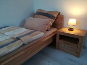 Ferienhaus Ostwald tesisinde bir odada yatak veya yataklar