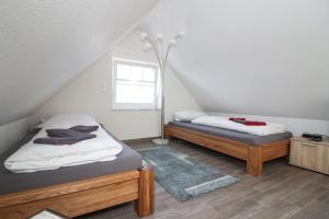 Postel nebo postele na pokoji v ubytování Mußestunde Greetsiel