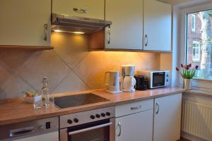 a kitchen with a sink and a counter top at Am Hof 2 in Staberdorf