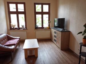 TV a/nebo společenská místnost v ubytování FeWo Stendal