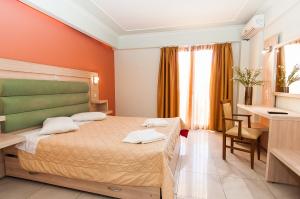 Ein Bett oder Betten in einem Zimmer der Unterkunft Zante Plaza Hotel & Apartments