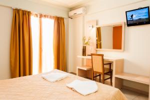 Ein Bett oder Betten in einem Zimmer der Unterkunft Zante Plaza Hotel & Apartments