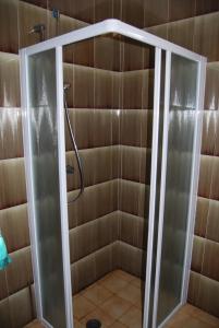 a shower with a glass door in a bathroom at Condominio San Michele in Bibione +122 photos
