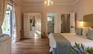 Postel nebo postele na pokoji v ubytování L'Auberge Chanteclair