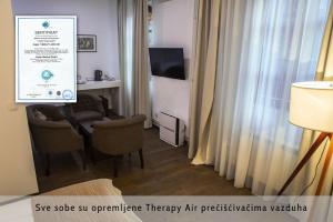 TV a/nebo společenská místnost v ubytování Garni Hotel Vila Drina