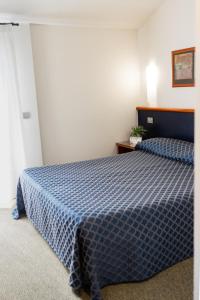 Posteľ alebo postele v izbe v ubytovaní Hotel Crystal