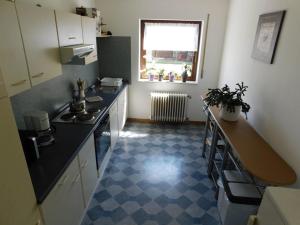 a kitchen with a sink and a counter top at FeWo Inge in Landscheid
