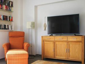 En tv och/eller ett underhållningssystem på Haus Cathleen Wohnung 1