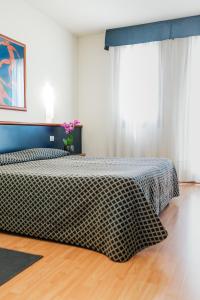 Posteľ alebo postele v izbe v ubytovaní Hotel Crystal