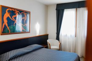 Posteľ alebo postele v izbe v ubytovaní Hotel Crystal