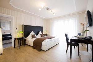 Postel nebo postele na pokoji v ubytování Hotel 'Zum Augarten'