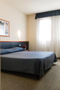 Posteľ alebo postele v izbe v ubytovaní Hotel Crystal