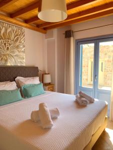 Tempat tidur dalam kamar di Modus Vivendi Villas