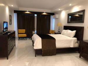 Säng eller sängar i ett rum på Golden House Hotel & Convention Center