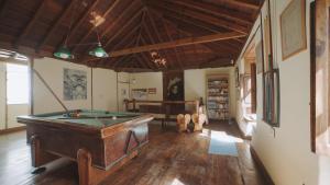 a room with a pool table and a library at Casa La Monja in Garachico