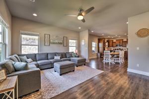 a living room with a couch and a table at Fayetteville House Pool Access and Gas Grill! in Fayetteville