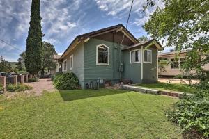 a small green house with a yard at Bisbee Home Less Than half Mi to Park and Tennis Courts! in Bisbee