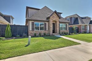 a house with a sign in the front yard at Fayetteville House Pool Access and Gas Grill! in Fayetteville