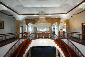 a view of the lobby of a building with a chandelier at Villa Jhoana Resort in Angono