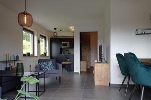 a living room with a couch and a table at Ferienwohnung Pistenblick in Winterberg in Winterberg