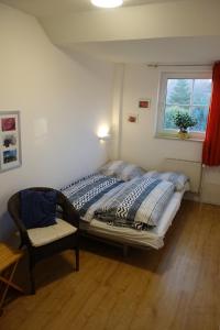En eller flere senge i et værelse på Haus Mehler