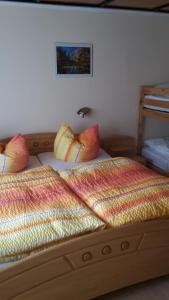 a bedroom with two beds with pillows on them at ferienwohnung köster in Ostseebad Karlshagen