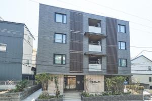 a large brick building with a staircase in front of it at ReLA Higashimatsudo - Vacation STAY 66996v in Matsudo