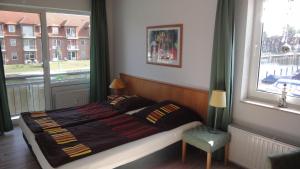 Postel nebo postele na pokoji v ubytování Hafenblick