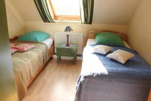 En eller flere senge i et værelse på Haus Wildgans - Ferienwohnung Sonnenblume