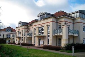 a large building with balconies on top of it at Residenz "Am Postplatz", Villa Sonja, Whg 9 in Zingst