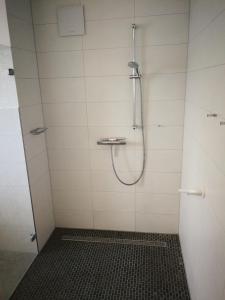 a bathroom with a shower with a shower head at Nike -barrierearm- in Burg auf Fehmarn