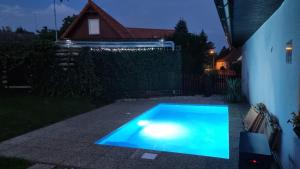 a swimming pool in a backyard at night at Chaloupka Rozkoš in Nové Město nad Metují