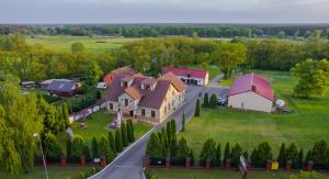 an aerial view of a large house and a road at Hotel Radzewice in Radzewice