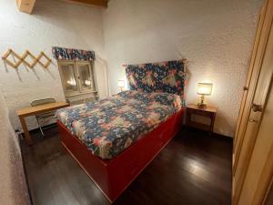 Postel nebo postele na pokoji v ubytování Casa Vacanze a Madonna di Campiglio