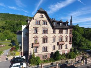 a large building with cars parked in front of it at Haus Bethania - Ferienwohnungen "Kategorie grande" in Bad Kissingen