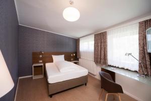 Postel nebo postele na pokoji v ubytování Seehörnle Bio Hotel & Gasthaus