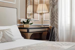Postel nebo postele na pokoji v ubytování Hotel Nuovo Teson