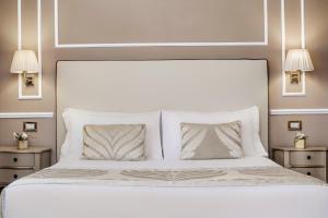 Postel nebo postele na pokoji v ubytování Hotel Nuovo Teson