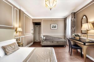 Postel nebo postele na pokoji v ubytování Hotel Nuovo Teson