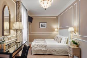 Postel nebo postele na pokoji v ubytování Hotel Nuovo Teson
