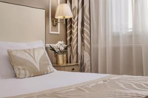 Postel nebo postele na pokoji v ubytování Hotel Nuovo Teson
