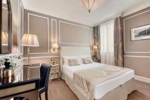 Postel nebo postele na pokoji v ubytování Hotel Nuovo Teson