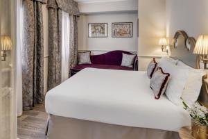 Postel nebo postele na pokoji v ubytování Hotel Nuovo Teson
