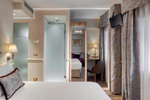 Postel nebo postele na pokoji v ubytování Hotel Nuovo Teson