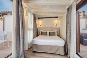 Postel nebo postele na pokoji v ubytování Hotel Nuovo Teson