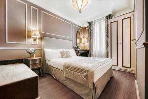 Postel nebo postele na pokoji v ubytování Hotel Nuovo Teson