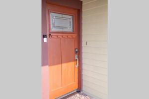 a wooden door on the side of a house at HISTORIC 2 Story Near DTLA/USC/LAFC/STAPLES CENTER in Los Angeles