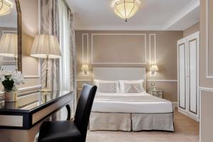 Postel nebo postele na pokoji v ubytování Hotel Nuovo Teson