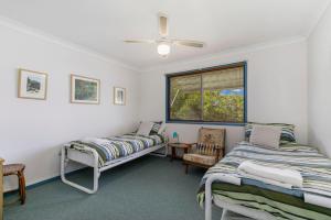 Ένα ή περισσότερα κρεβάτια σε δωμάτιο στο Myralla