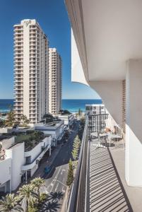 an apartment balcony with a view of the ocean at The Island Gold Coast in Gold Coast
